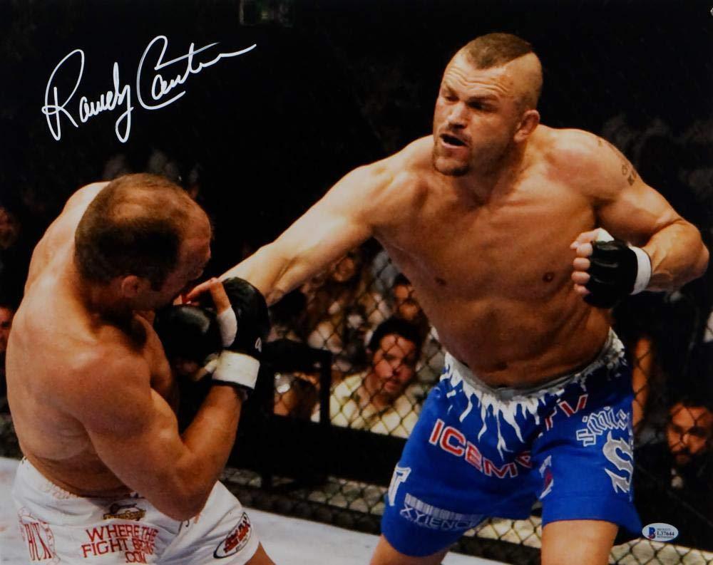Randy Couture Autographed UFC 16x20 Hit By Liddell Photo- Beckett Auth White - Image 2
