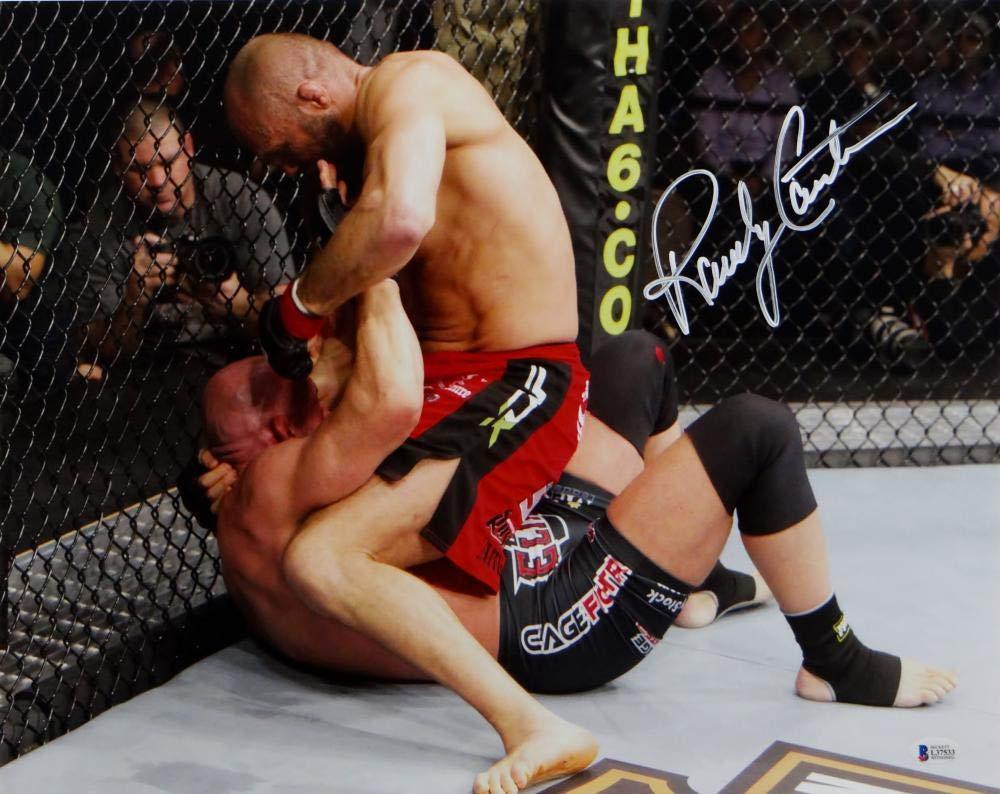 Randy Couture Autographed UFC 16x20 On Top Punching Photo- Beckett Auth White - Image 2